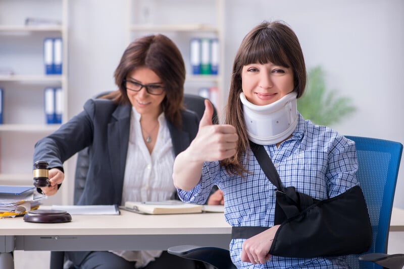 workers compensation injured female employee smiling
