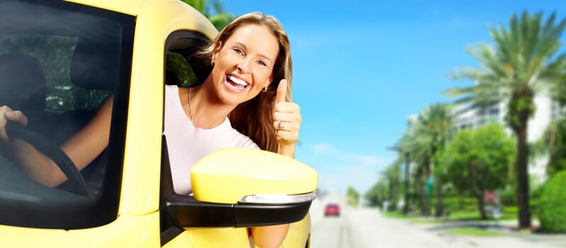 Lady smiling in transport vehicle happy