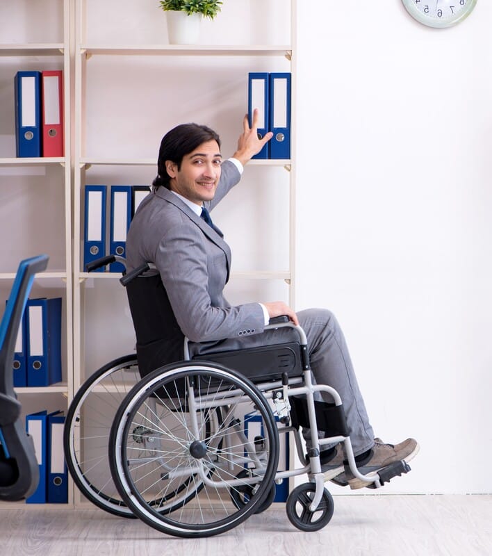 Man in wheelchair employee workers compensation happy